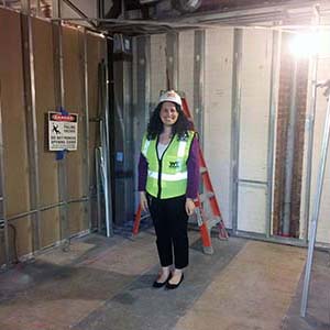 Lab manager Catherine DeRose standing in her future office