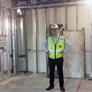 Lab developer Douglas Duhaime standing in his future office